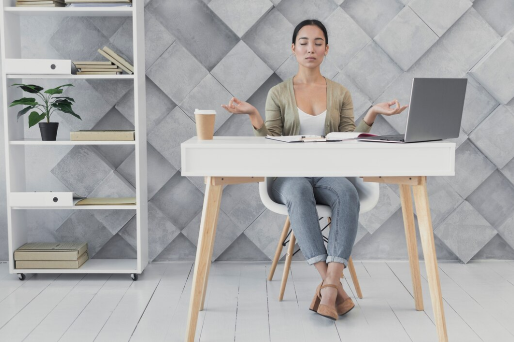 Woman at a desk finding work-life balance.